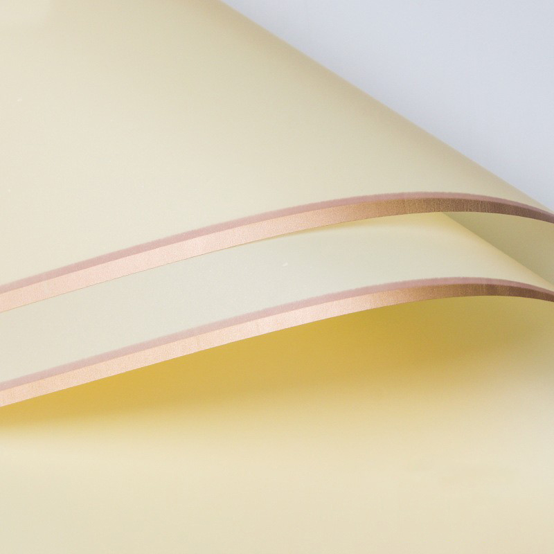 Papier cadeau fleur mat bordé d'or