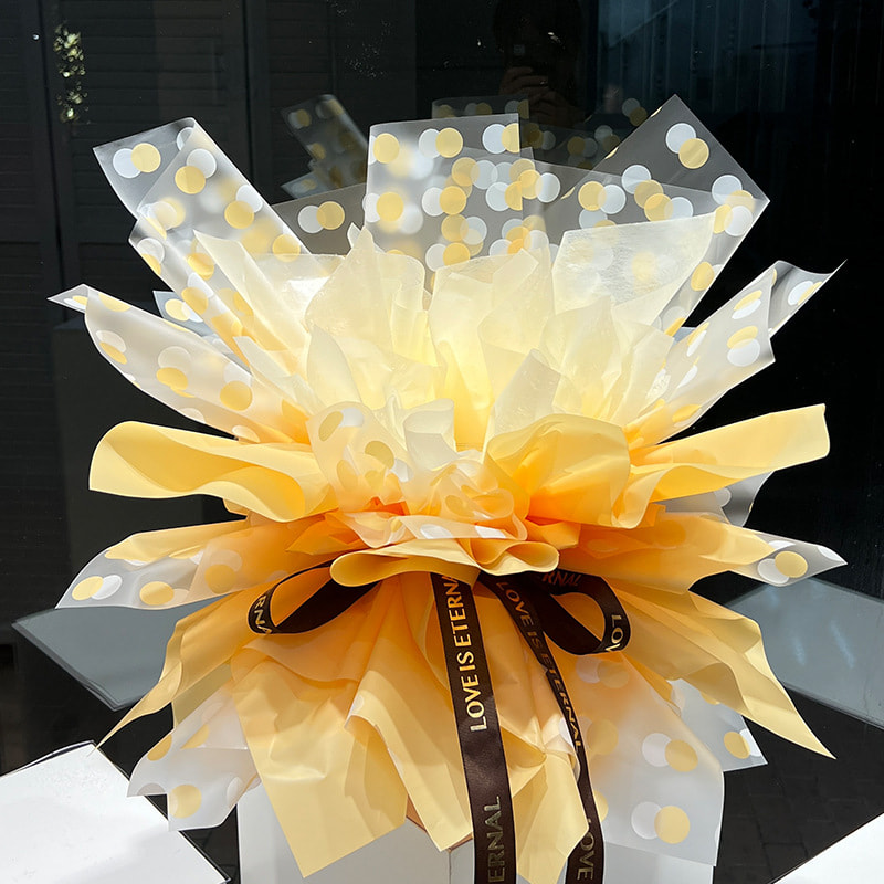 Papier d'emballage transparent à fleurs à pois