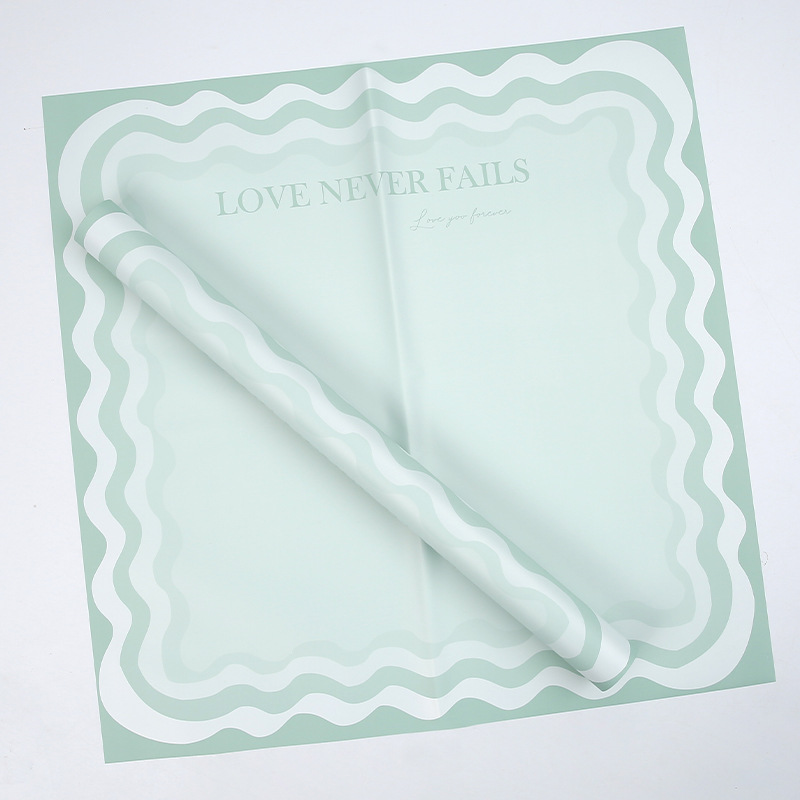 Papier d'emballage de fleurs solides avec bord ondulé