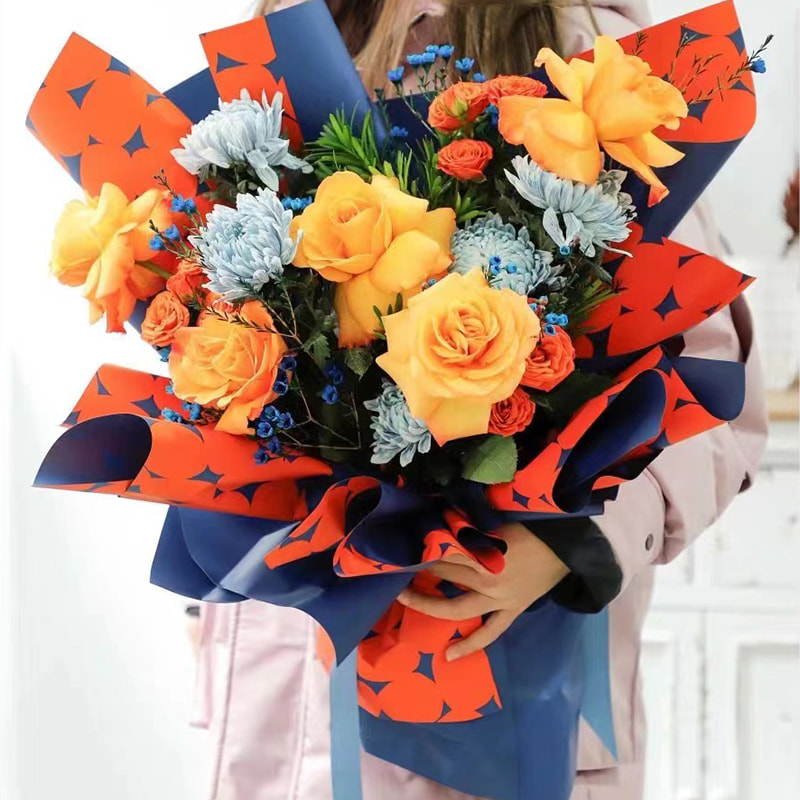 Papier cadeau fleur à pois bicolore